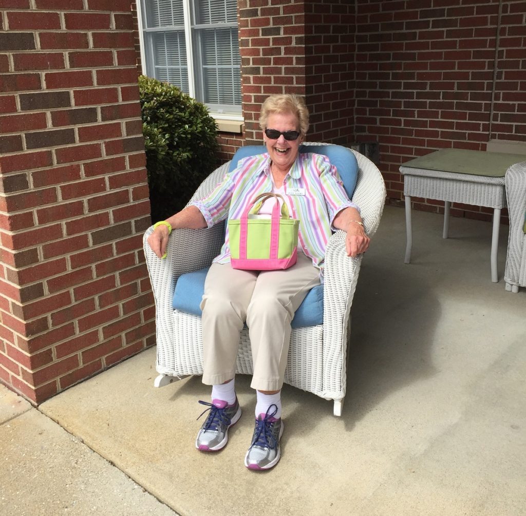 Happy Senior Resident sitting outside during Easter Parade