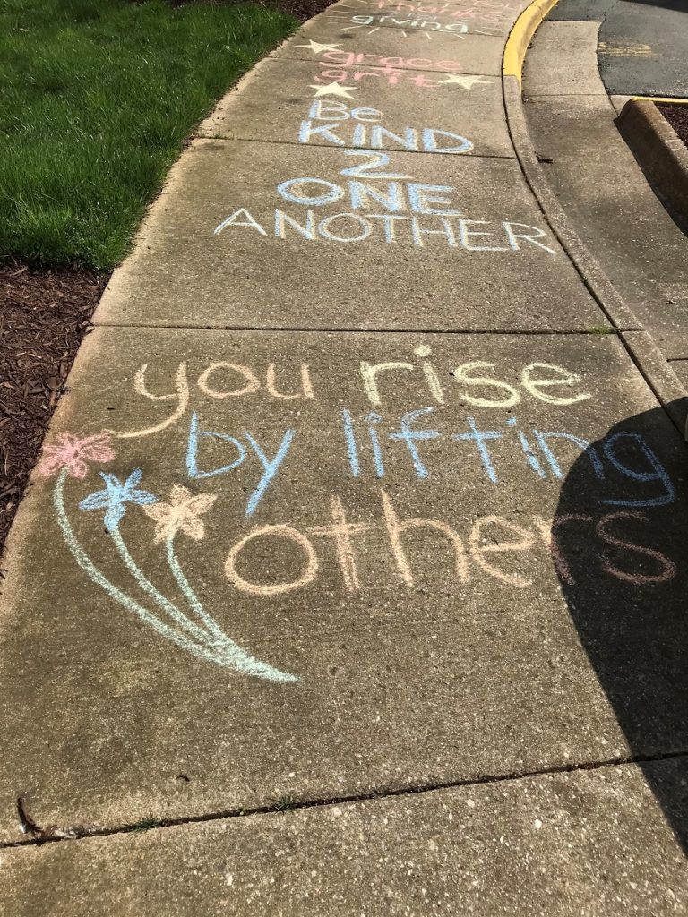 chalk art on sidewalks to display love and support to senior residents