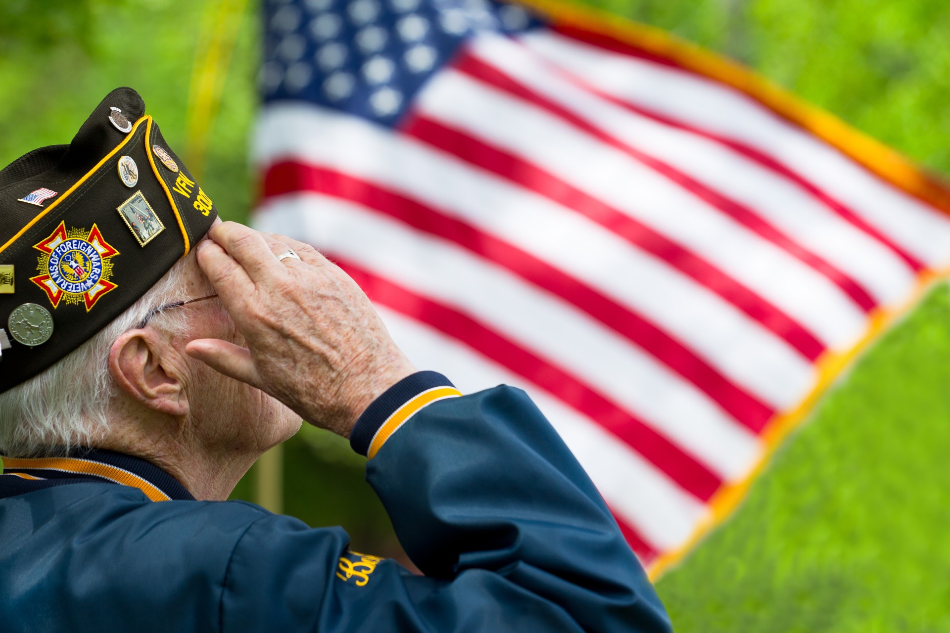 Senior veteran saluting the Unites States flag