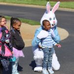 Children with the Easter Bunny at the Bunny Hop event