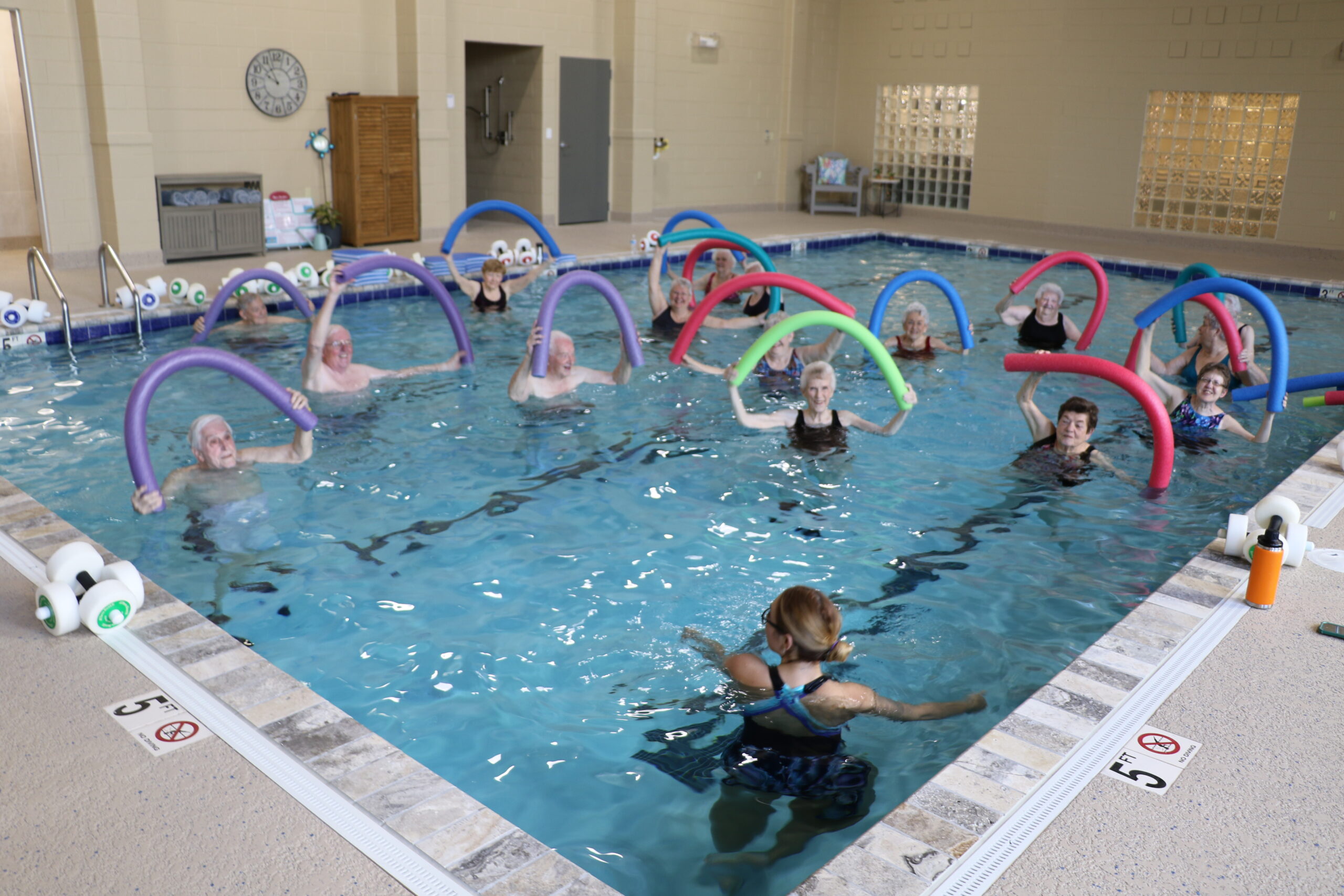 Seniors participating in aqua aerobics class