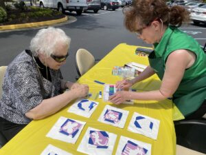 National Senior Health and Fitness Day, Fitness Festival. Display of canvas for seniors to paint.