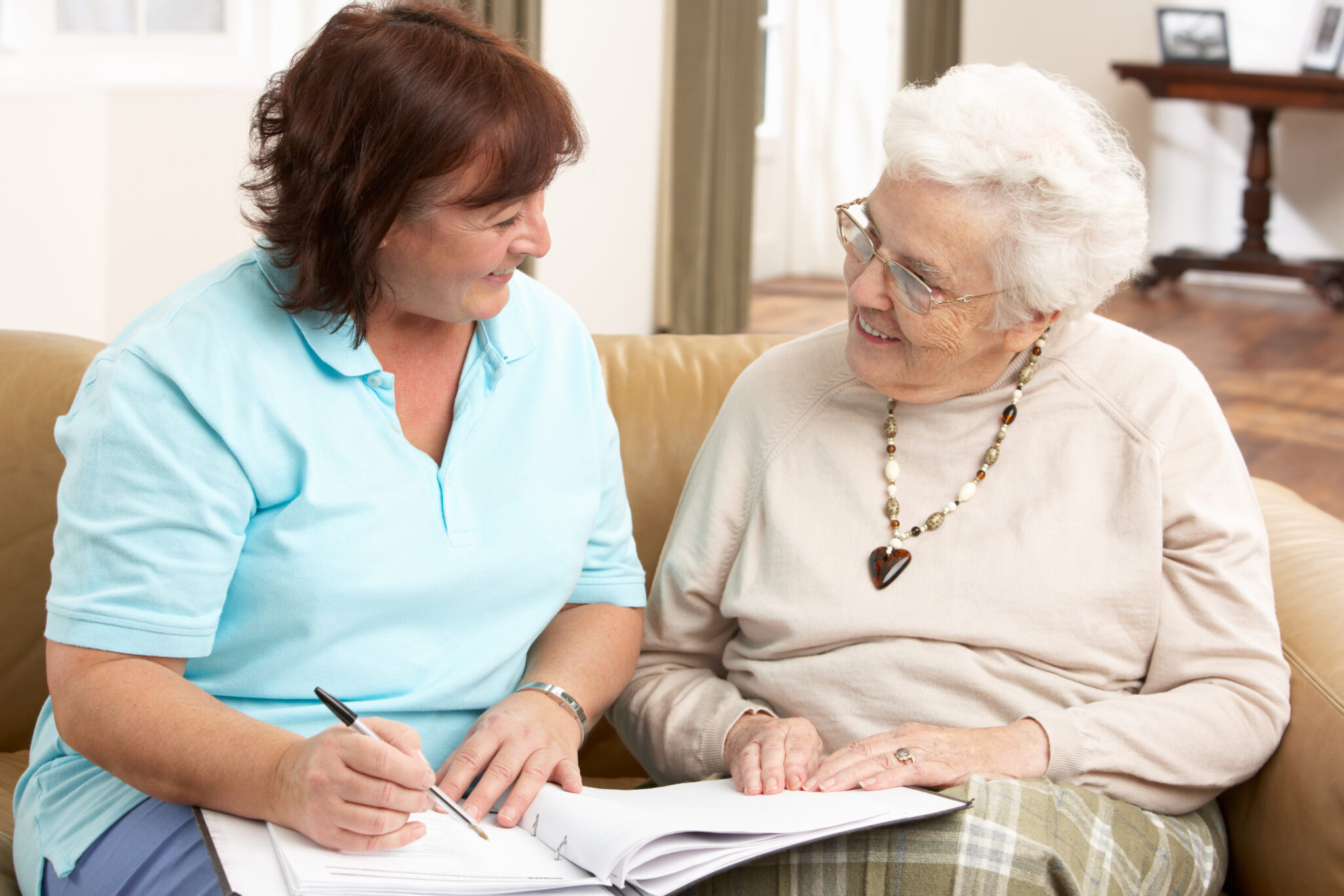 senior woman talking with Health Visitor