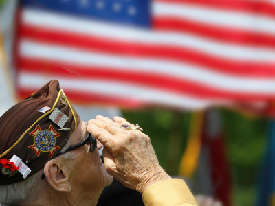senior resident Veteran saluting the flag The Chesapeake Independent Living Community